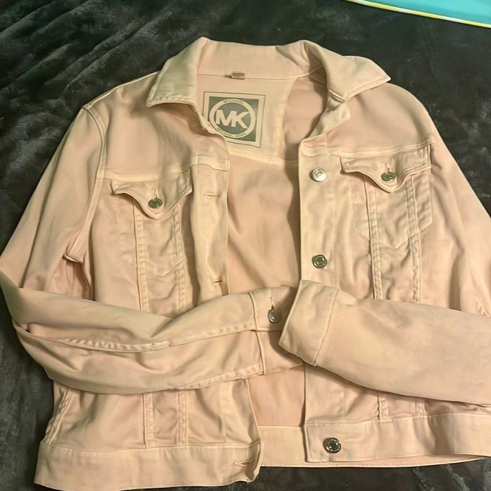 Light pink Michael Kors jean jacket. Never worn. Price dropped to 20 dollars!!